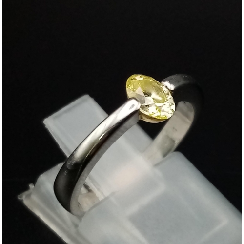 219 - An Platinum and Fancy Yellow Diamond (0.45ct) Ring. VS1 clarity. Size K. 4.06g total weight. Comes w... 