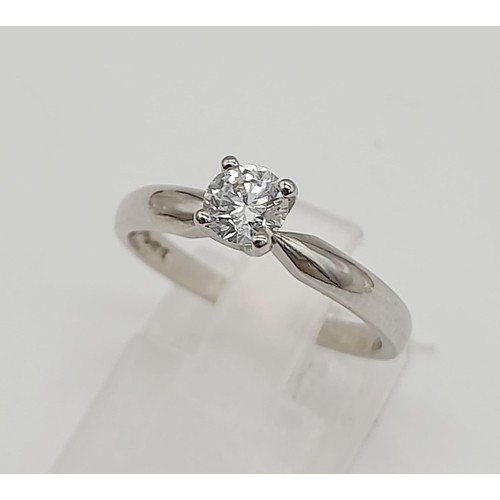 387 - A 950 Platinum Diamond Solitaire Ring. Crystal-clear 0.2ct round cut diamond. Size L. 3.7g total wei... 