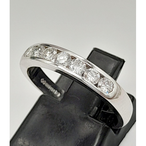 423 - An 18K White Gold Diamond Half-Eternity Ring. 0.42ct of round-cut diamonds. Size M. 3.67g total weig... 