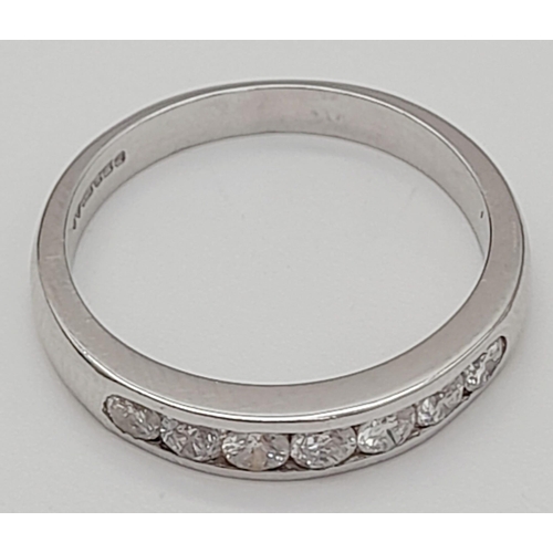 423 - An 18K White Gold Diamond Half-Eternity Ring. 0.42ct of round-cut diamonds. Size M. 3.67g total weig... 