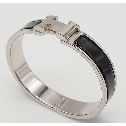 48 - A Hermes White Metal and Black Enamel Designer Bangle.