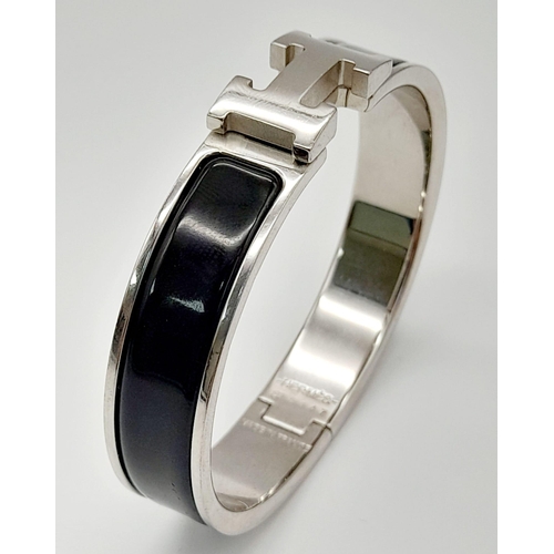 48 - A Hermes White Metal and Black Enamel Designer Bangle.