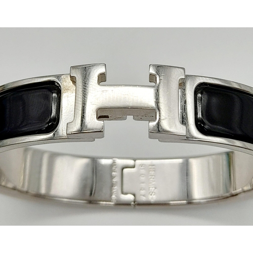 48 - A Hermes White Metal and Black Enamel Designer Bangle.