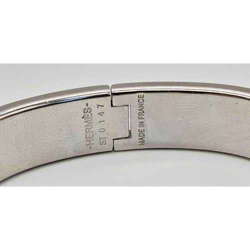 48 - A Hermes White Metal and Black Enamel Designer Bangle.