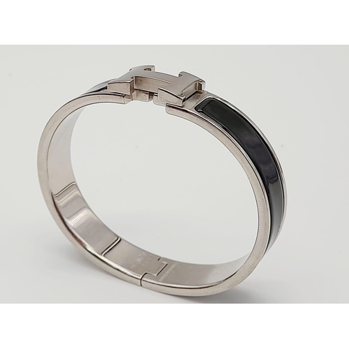 48 - A Hermes White Metal and Black Enamel Designer Bangle.