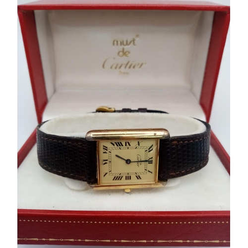 499 - A Vintage Cartier Quartz Tank 925 Silver Vermeil Watch. Brown leather strap. Case - 24mm. In working... 