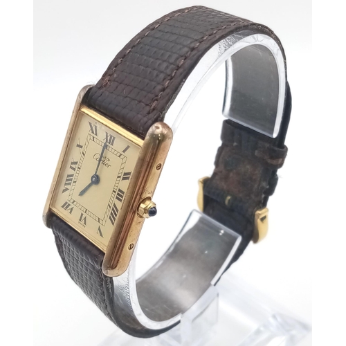 499 - A Vintage Cartier Quartz Tank 925 Silver Vermeil Watch. Brown leather strap. Case - 24mm. In working... 