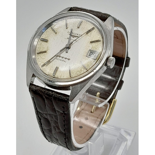 597 - A Vintage Longines Automatic Gents Watch. Brown leather strap. Case - 35mm. Discoloured dial with da... 