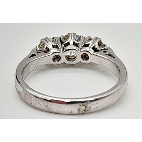 668 - An 18K White Gold Diamond Trilogy Ring. 1ct of brilliant round-cut diamonds. Size L 1/2. 4.5g total ... 