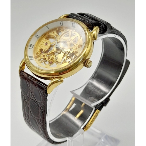 694 - A Benrus 17 Jewel Skeleton Gents Watch. Brown leather strap. Skeleton case - 31mm. Automatic movemen... 