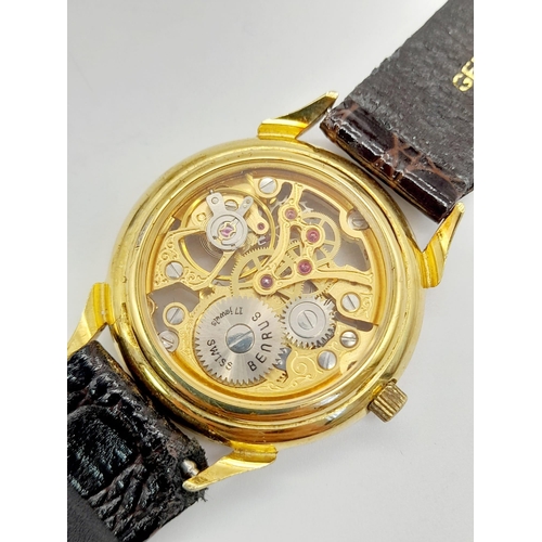 694 - A Benrus 17 Jewel Skeleton Gents Watch. Brown leather strap. Skeleton case - 31mm. Automatic movemen... 