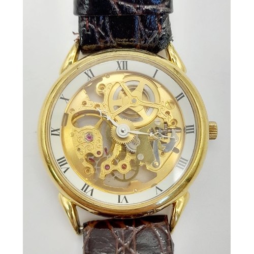 694 - A Benrus 17 Jewel Skeleton Gents Watch. Brown leather strap. Skeleton case - 31mm. Automatic movemen... 