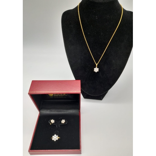 75 - An 18K Yellow Gold Floral Decorative Diamond Jewellery Set.
A necklace with pendant, ring and a pair... 