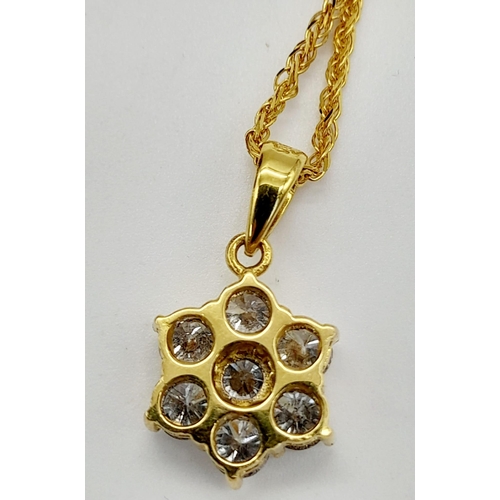 75 - An 18K Yellow Gold Floral Decorative Diamond Jewellery Set.
A necklace with pendant, ring and a pair... 