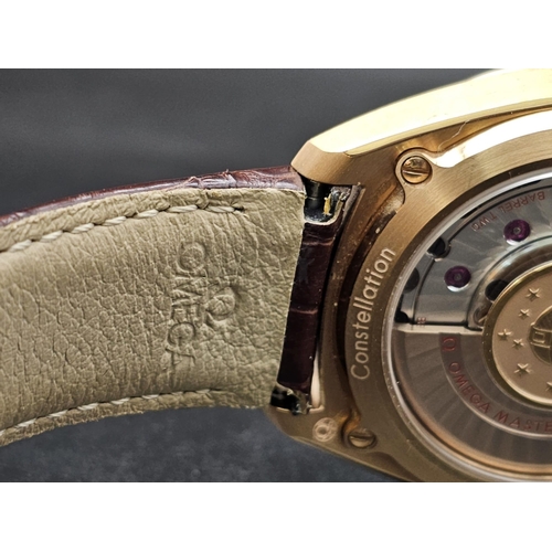 226 - An Omega Globemaster Constellation 18K Rose Gold Gents Watch. Brown leather strap with 18k rose gold... 