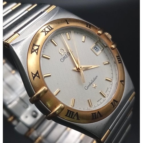 380 - An Omega Constellation Two Tone Gents Watch. Two tone strap and case - 33mm. Cream dial with date wi... 