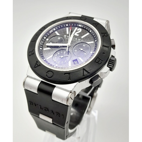 402 - A Bulgari Aluminium Gents Chronograph Watch. Black Rubber strap. Case - 43mm. Quartz movement. In wo... 