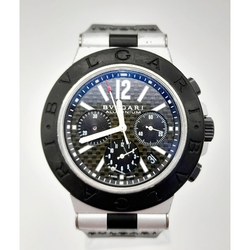 402 - A Bulgari Aluminium Gents Chronograph Watch. Black Rubber strap. Case - 43mm. Quartz movement. In wo... 