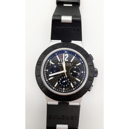 402 - A Bulgari Aluminium Gents Chronograph Watch. Black Rubber strap. Case - 43mm. Quartz movement. In wo... 