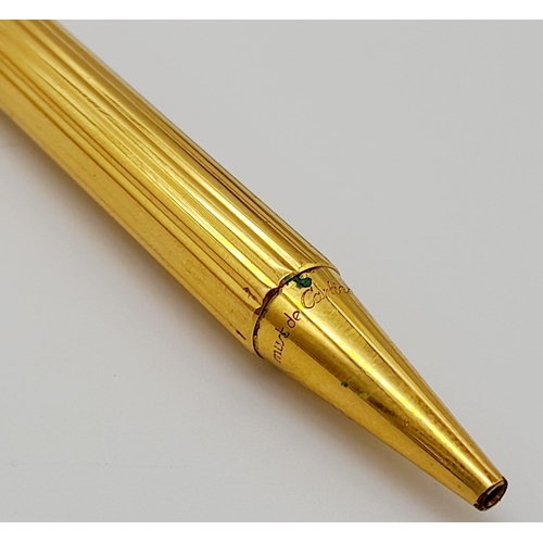 520 - A Set of Two Gold Plated Cartier Pens. A rollerball and ballpoint. Presented in a leather burgundy p... 