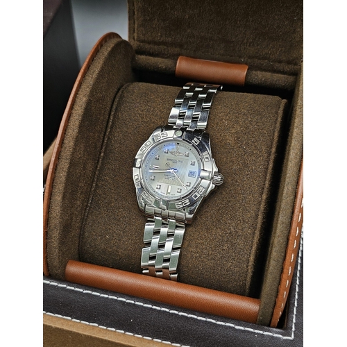 61 - A Breitling Galactic Automatic Ladies Watch. Stainless steel strap and case - 31mm. Cream dial with ... 