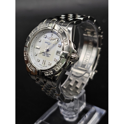 61 - A Breitling Galactic Automatic Ladies Watch. Stainless steel strap and case - 31mm. Cream dial with ... 