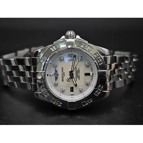 61 - A Breitling Galactic Automatic Ladies Watch. Stainless steel strap and case - 31mm. Cream dial with ... 