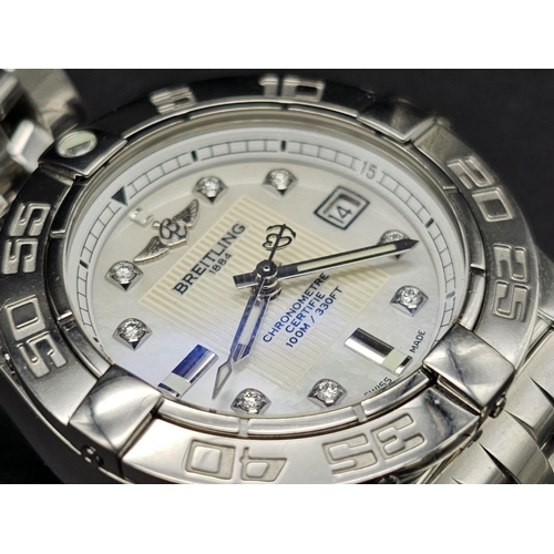 61 - A Breitling Galactic Automatic Ladies Watch. Stainless steel strap and case - 31mm. Cream dial with ... 