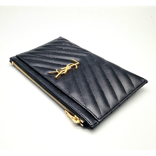 912 - A Yves Saint Laurent Black Leather Clutch Bag. Chevron design. Gilded YSL emblem. Dust cover and box... 