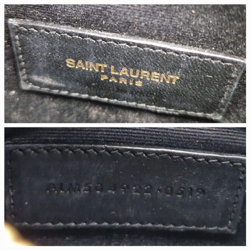 912 - A Yves Saint Laurent Black Leather Clutch Bag. Chevron design. Gilded YSL emblem. Dust cover and box... 