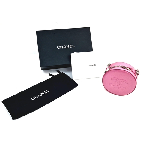 138 - A Chanel Round as Earth Patent Pink Leather Bag. Zipped closure. One interior pocket. Shoulder strap... 