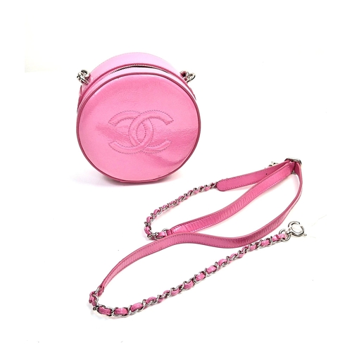 138 - A Chanel Round as Earth Patent Pink Leather Bag. Zipped closure. One interior pocket. Shoulder strap... 