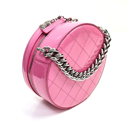 138 - A Chanel Round as Earth Patent Pink Leather Bag. Zipped closure. One interior pocket. Shoulder strap... 