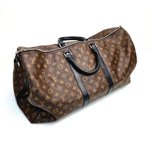 184 - A Louis Vuitton Keepall Hand-Luggage Bag. Brown monogram canvas with black leather handles and trim.... 