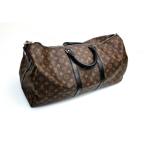 184 - A Louis Vuitton Keepall Hand-Luggage Bag. Brown monogram canvas with black leather handles and trim.... 