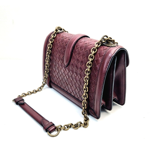 20 - A Bottega Veneta City Knot Bag. Burgundy lambskin leather. Flap closure. Two interior compartments. ... 