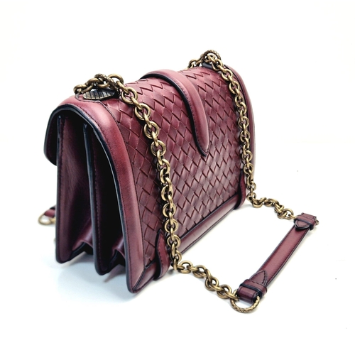 20 - A Bottega Veneta City Knot Bag. Burgundy lambskin leather. Flap closure. Two interior compartments. ... 