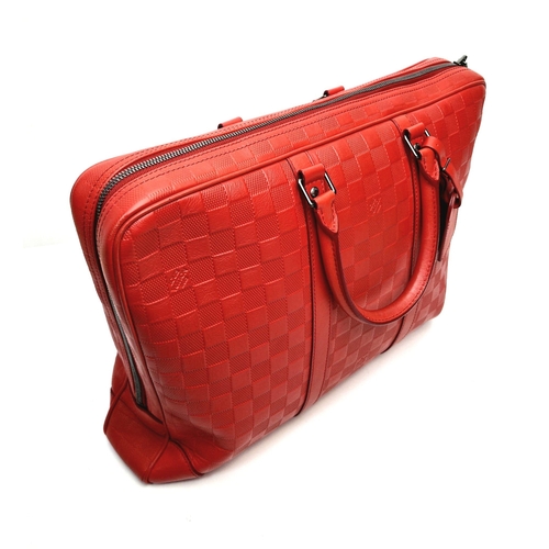 21 - A Louis Vuitton Red Leather Document Bag. Monogram checked red leather. Silver-tone hardware with pa... 