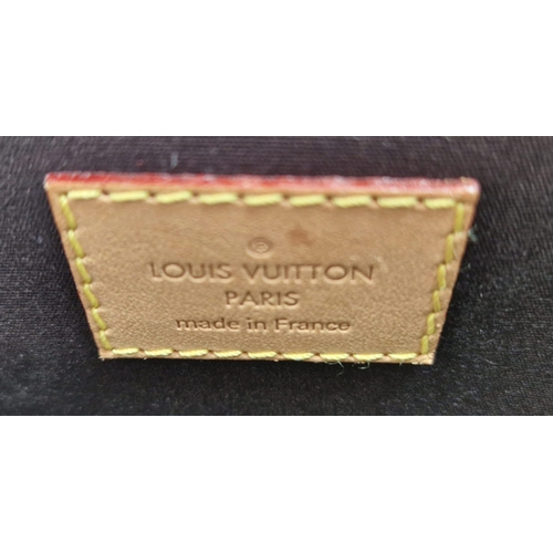 317 - A Louis Vuitton Amarante Alma Vernis Handbag. Patent purple monogram leather. Gilded zip and padlock... 