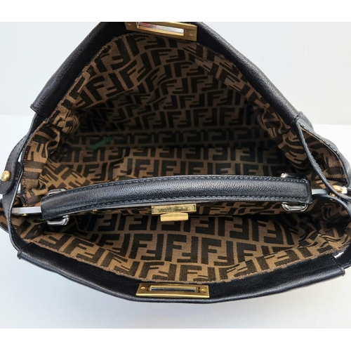 416 - A Fendi Black Leather Double Compartment Hand/Shoulder Bag. Silver and gold tone hardware. Detachabl... 