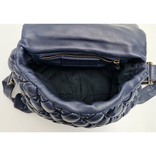 513 - A Balanciaga Blue Leather Puff Bag. Adjustable handle. Quilted soft blue leather. Interior zip pocke... 