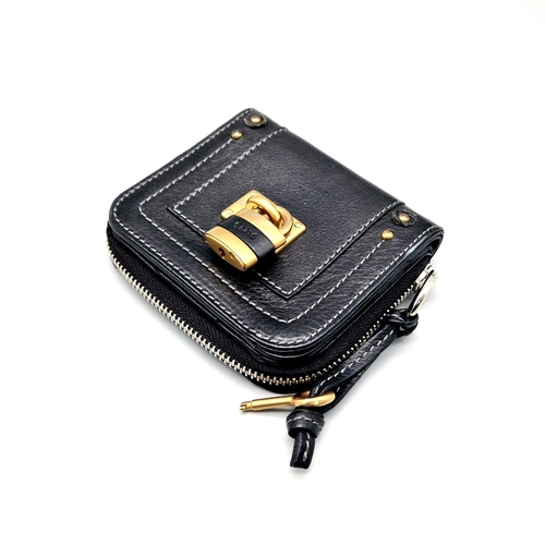 580 - A Chloe Paddington Clutch Purse/Wallet. Gold-tone padlock with key. Zipped and clip closures. Dust c... 