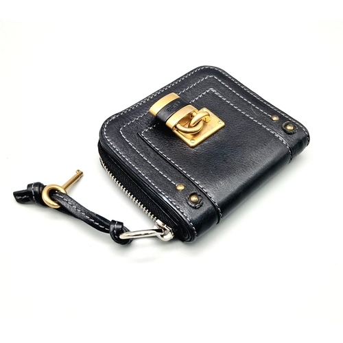 580 - A Chloe Paddington Clutch Purse/Wallet. Gold-tone padlock with key. Zipped and clip closures. Dust c... 