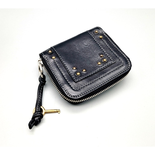 580 - A Chloe Paddington Clutch Purse/Wallet. Gold-tone padlock with key. Zipped and clip closures. Dust c... 