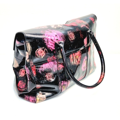 661 - A Mulberry Classic Bayswater Patent Leather Handbag. Decorated with scribbly floral print. Gunmetal ... 