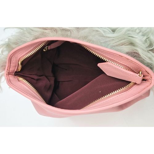 663 - A Burberry Prorsum Crossbody Pink Leather Bag. Gold-tone hardware. Fur trim. Adjustable shoulder str... 