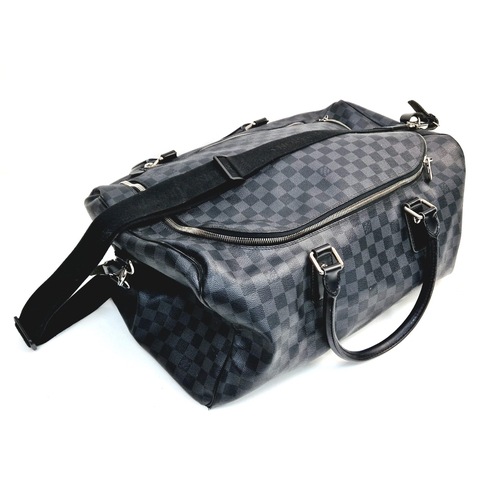 68 - A Louis Vuitton Keepall Hand-Luggage Bag. Black checked leather. Leather handles and trim. Shoulder ... 