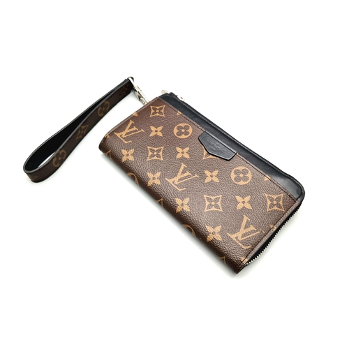 859 - A Louis Vuitton Clutch Wallet with Handle. Brown monogram canvas. Silver-tone hardware. Zipped inter... 