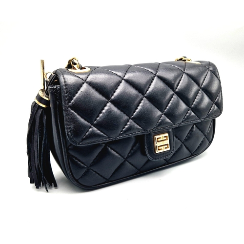 884 - A Givenchy Black Quilted Leather Flap Handbag. Gold-tone hardware. Zipped interior pocket. Please se... 