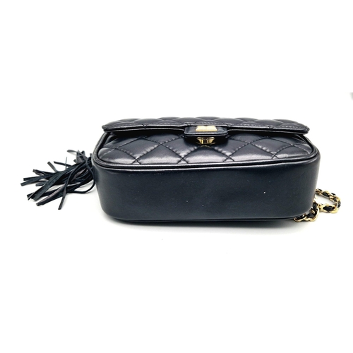 884 - A Givenchy Black Quilted Leather Flap Handbag. Gold-tone hardware. Zipped interior pocket. Please se... 